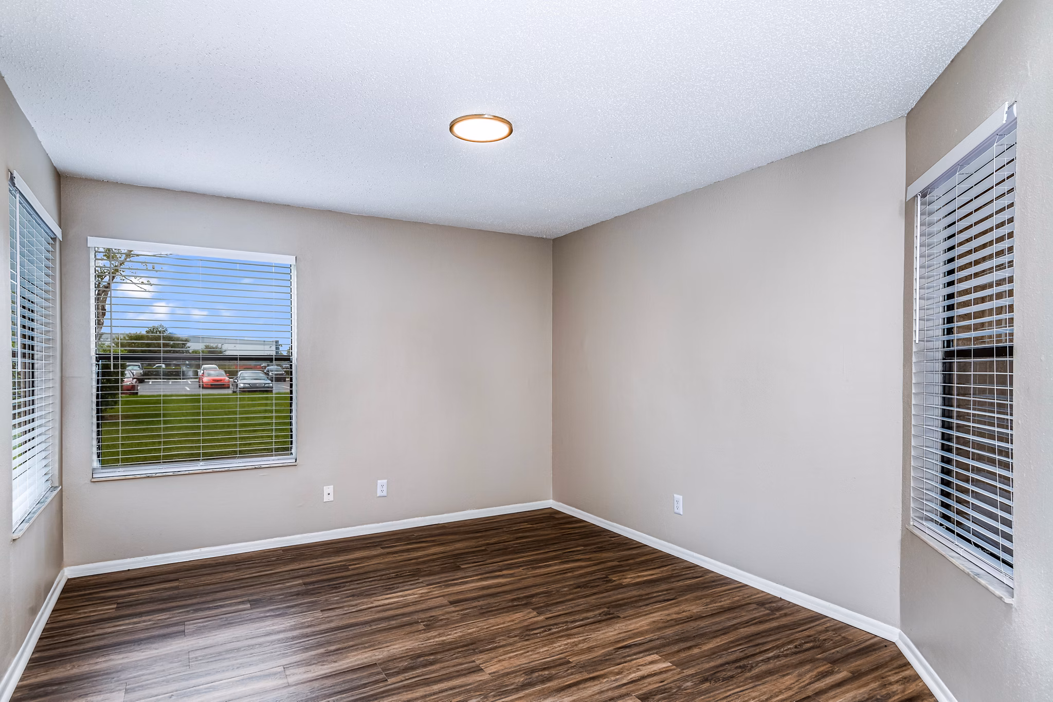 Dining room featuring a modern dining set and pendant lighting at Heron Lake Apartments