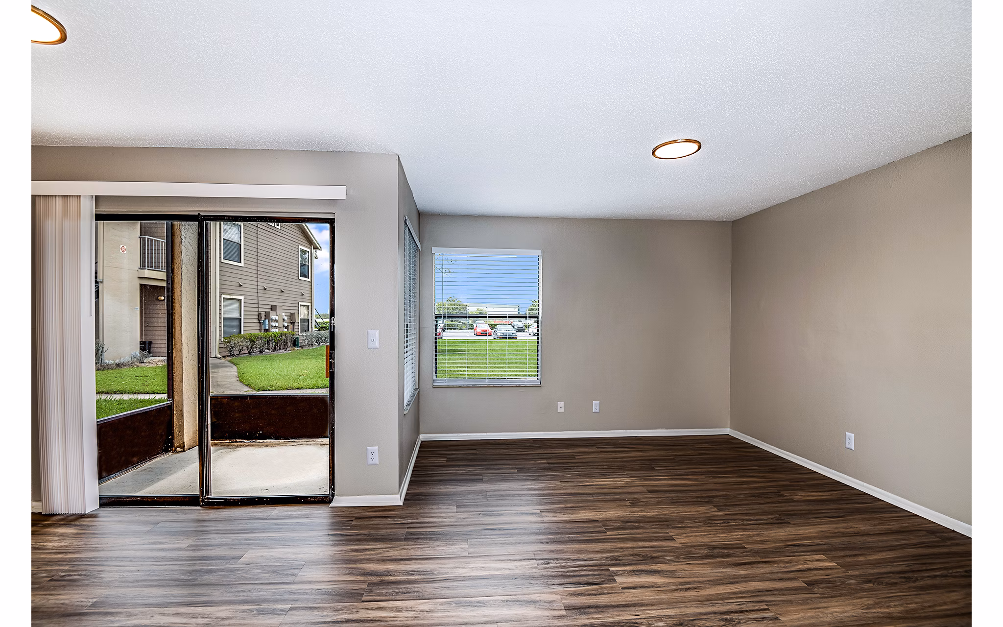 Spacious living room with modern furnishings at Heron Lake Apartments