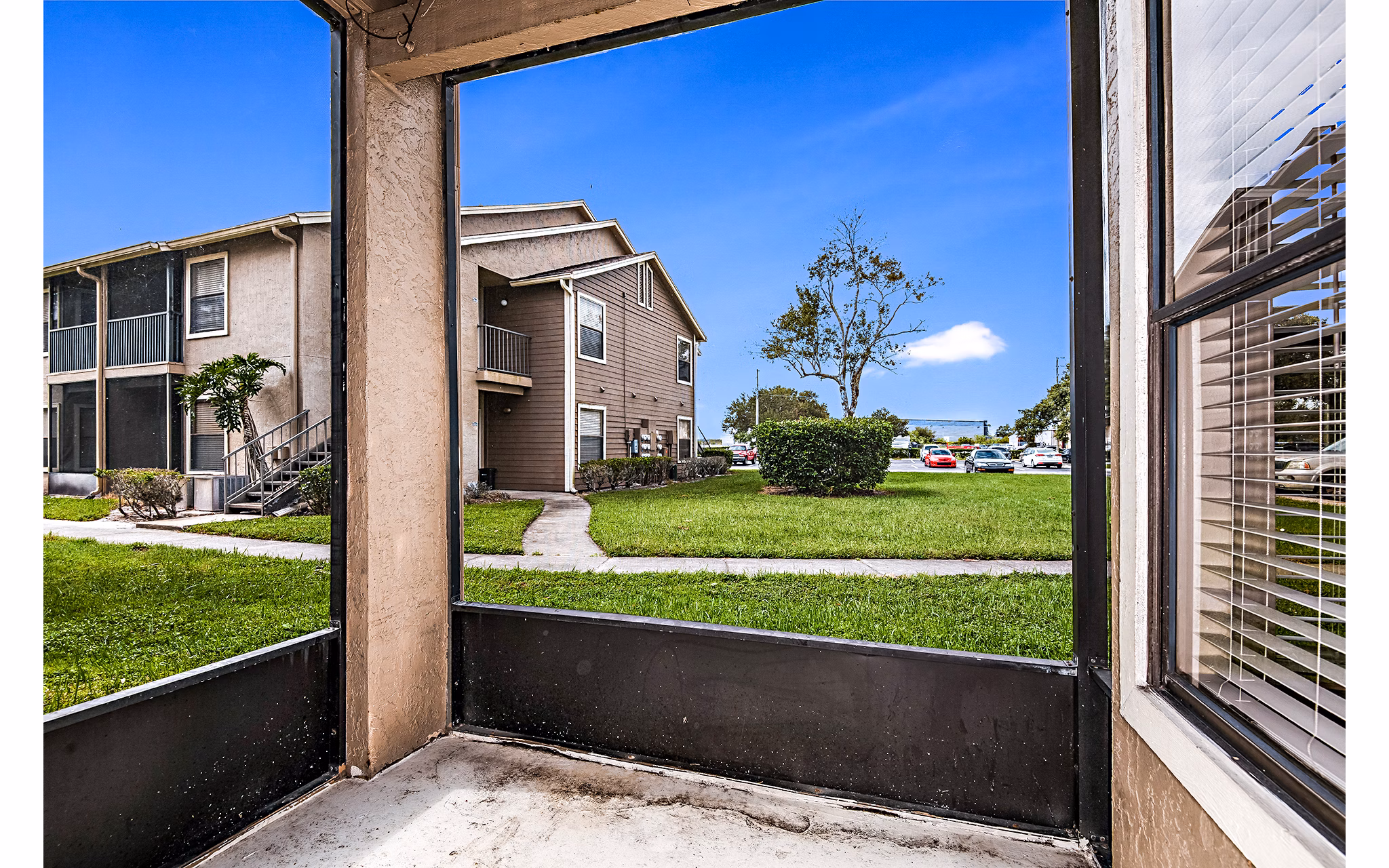 Patio with scenic lake views at Heron Lake Apartments, a luxury living community
