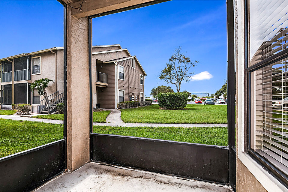 Patio with scenic lake views at Heron Lake Apartments, a luxury living community