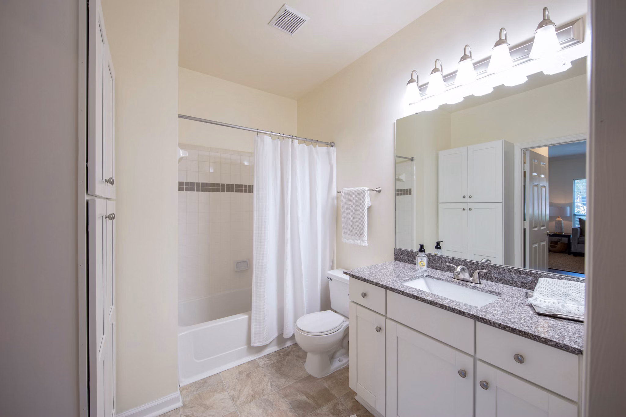 Luxurious bathroom with marble countertops at 42 Magnolia, part of 5000 Forest Apartments