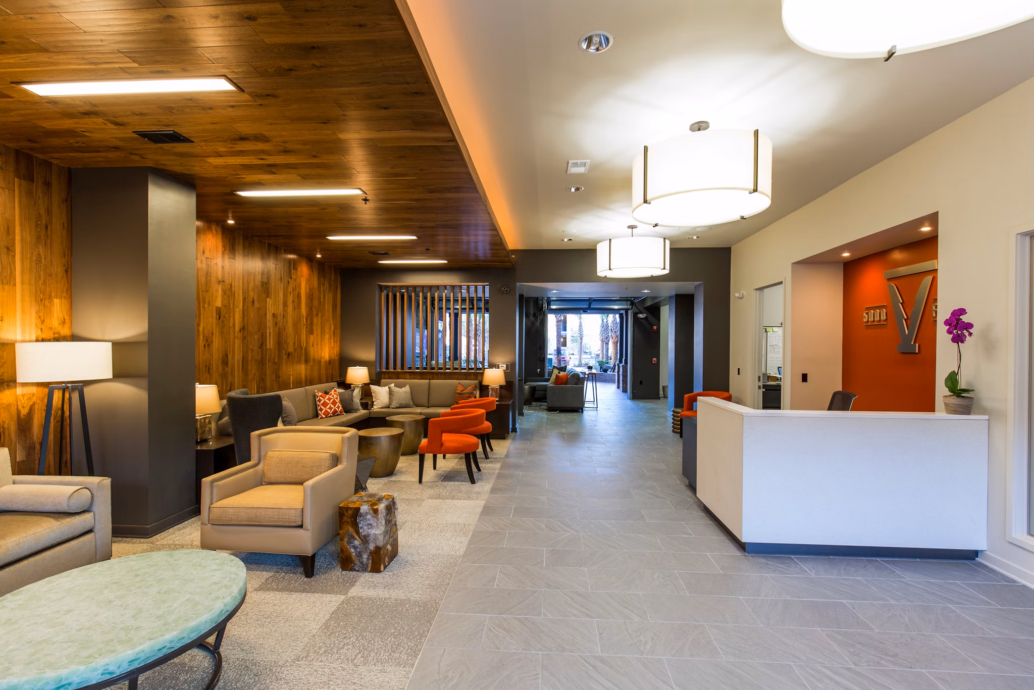 Modern clubhouse/lobby with elegant seating and bright decor at 42 Magnolia + 5000 Forest luxury apartments