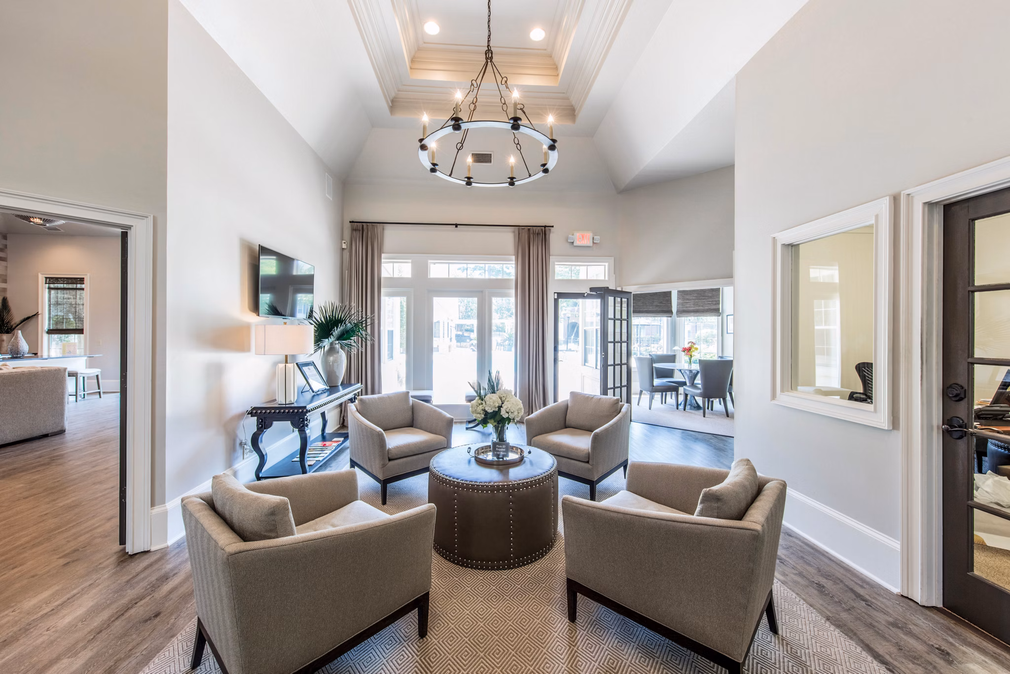 Clubhouse with modern decor and ample seating at 42 Magnolia and 5000 Forest Apartments, luxurious Greystar-managed communities