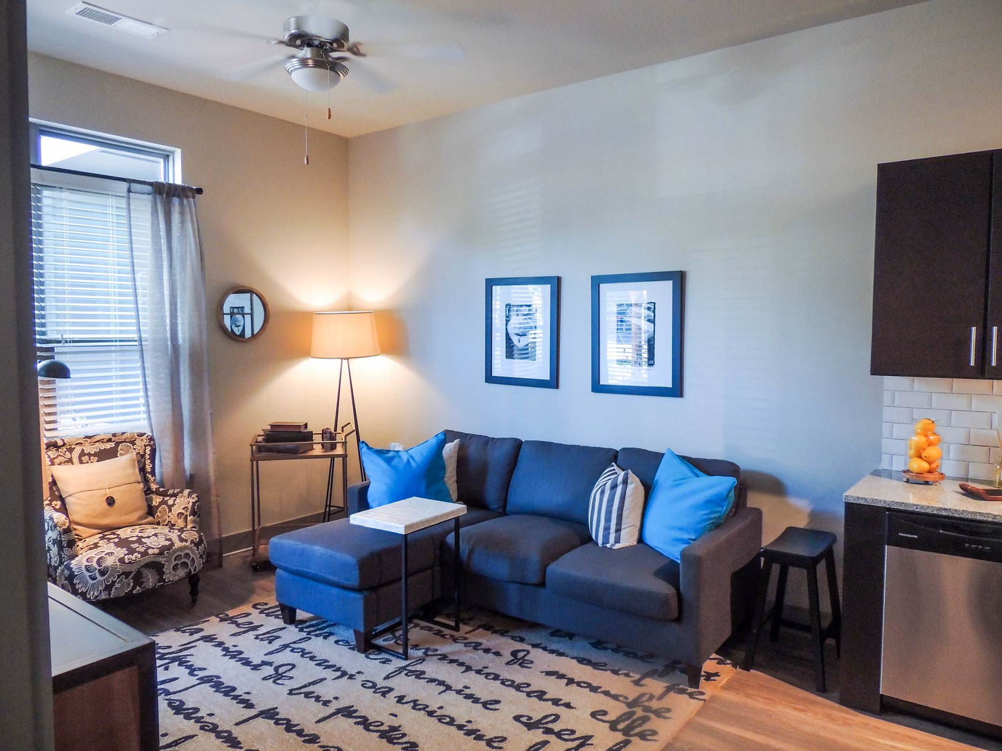 Bright, modern living room with stylish furnishings at 42 Magnolia + 5000 Forest Apartments
