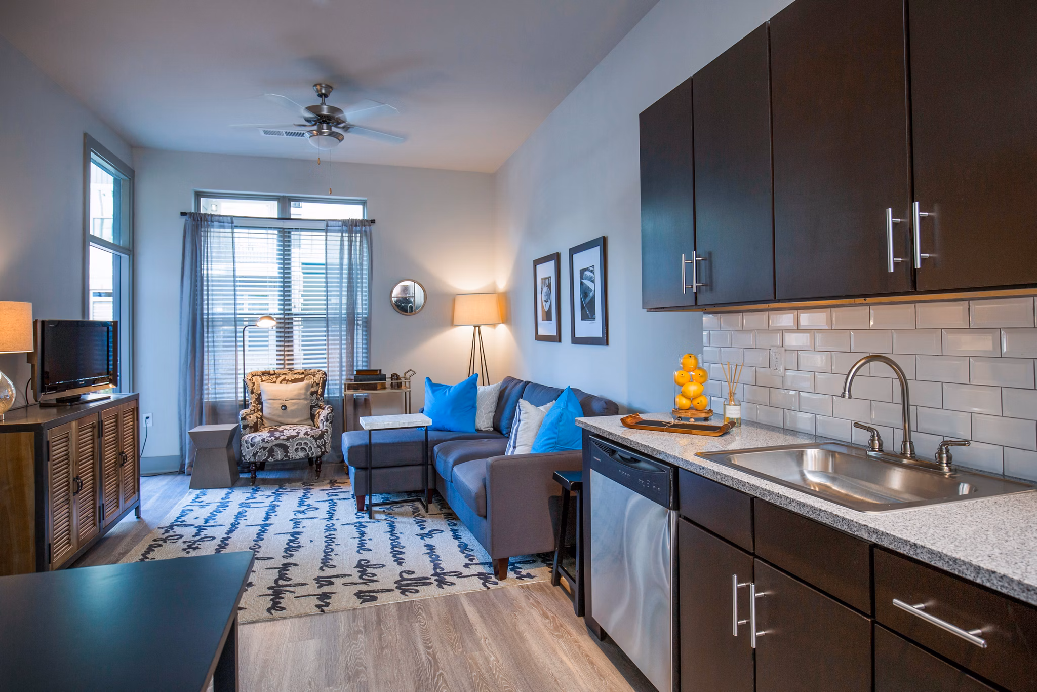 Modern living room with stylish furniture and natural light in 42 Magnolia at 5000 Forest Apartments
