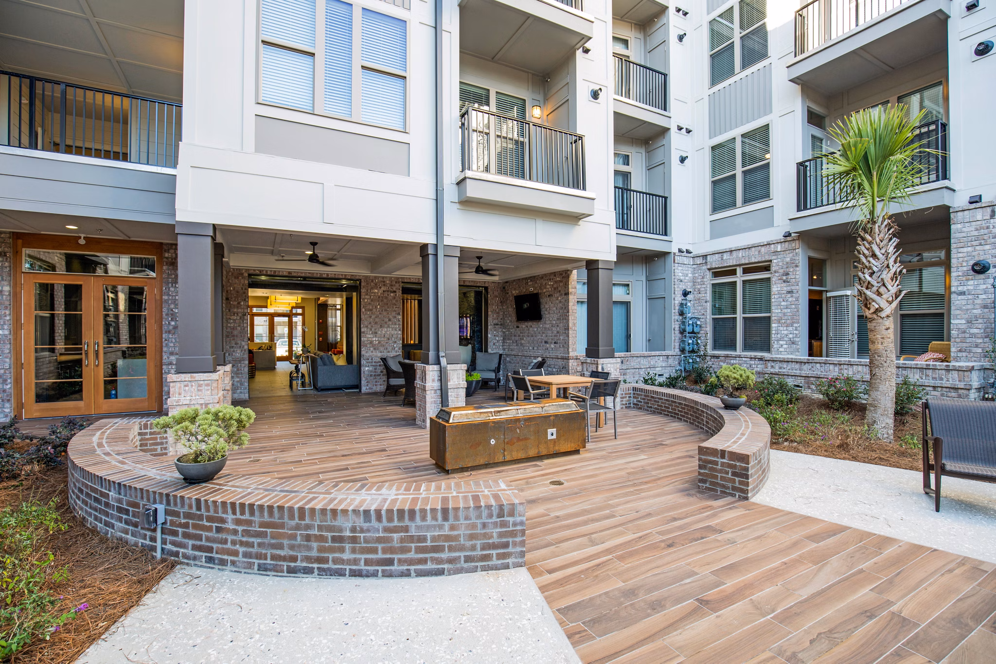Inviting patio with modern seating at 42 Magnolia within 5000 Forest Apartments