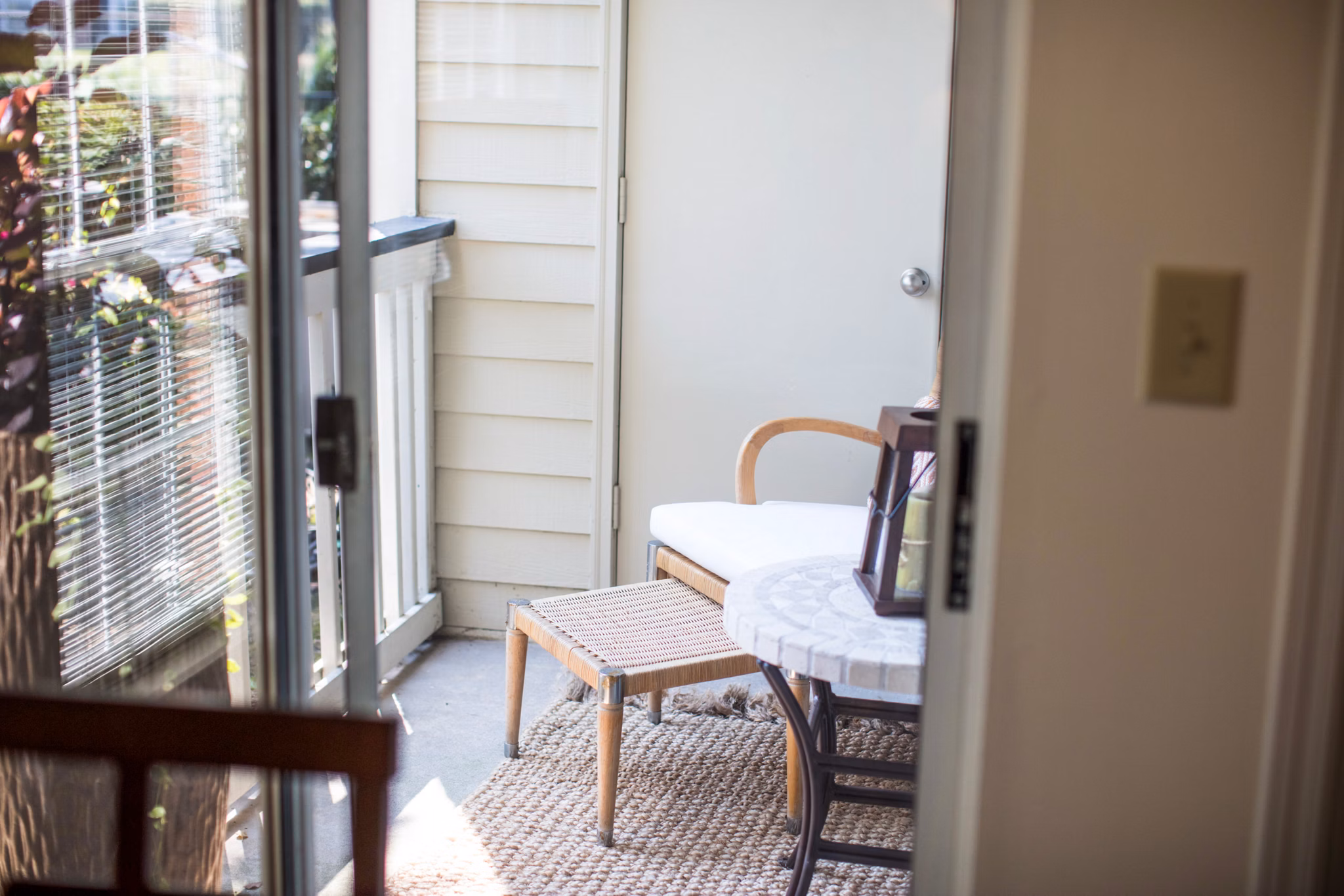 Cozy patio with stylish seating at 42 Magnolia, part of the luxurious 5000 Forest Apartments community