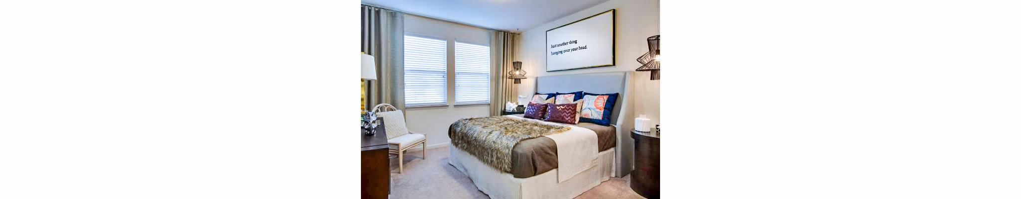 Tapestry at Lake Park Apartments: Elegant bedroom featuring plush bedding and natural light