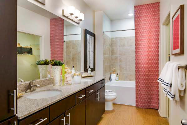 Bathroom featuring modern fixtures and marble countertops in Tapestry at Lake Park Apartments