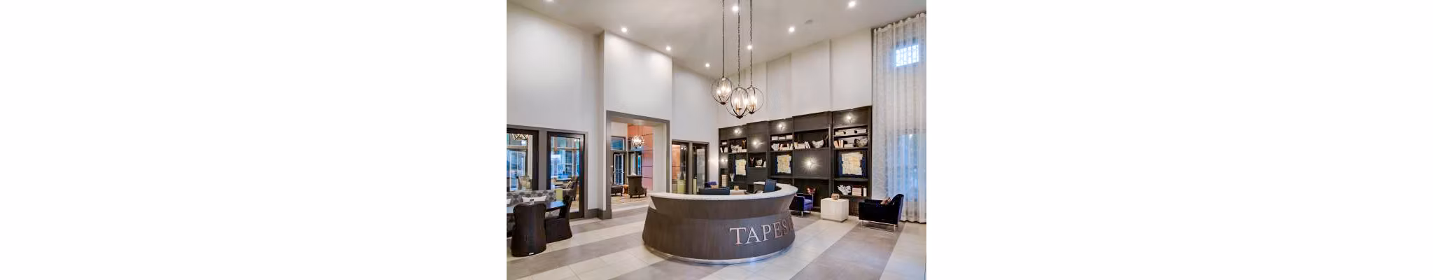 Clubhouse featuring modern seating and elegant decor at Tapestry at Lake Park Apartments