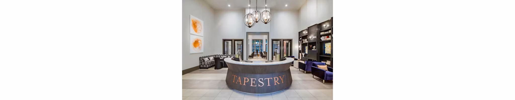 Clubhouse lobby with modern seating and decor at Tapestry at Lake Park Apartments