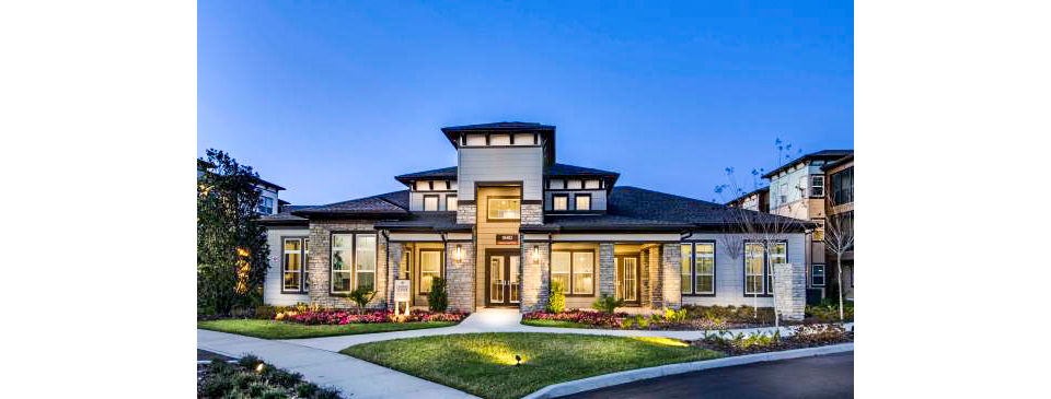 Clubhouse with modern design and cozy seating at Tapestry at Lake Park Apartments