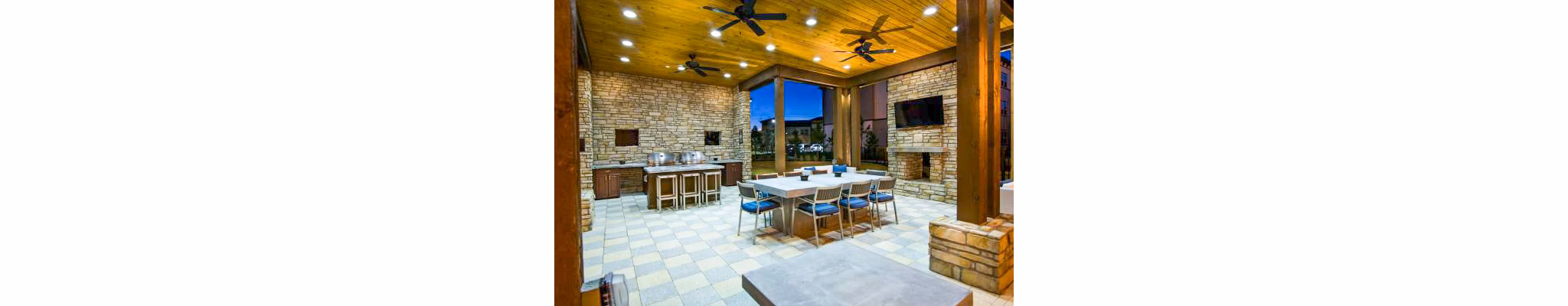 Patio grill area with outdoor seating at Tapestry at Lake Park Apartments, perfect for outdoor dining and socializing in a luxury setting