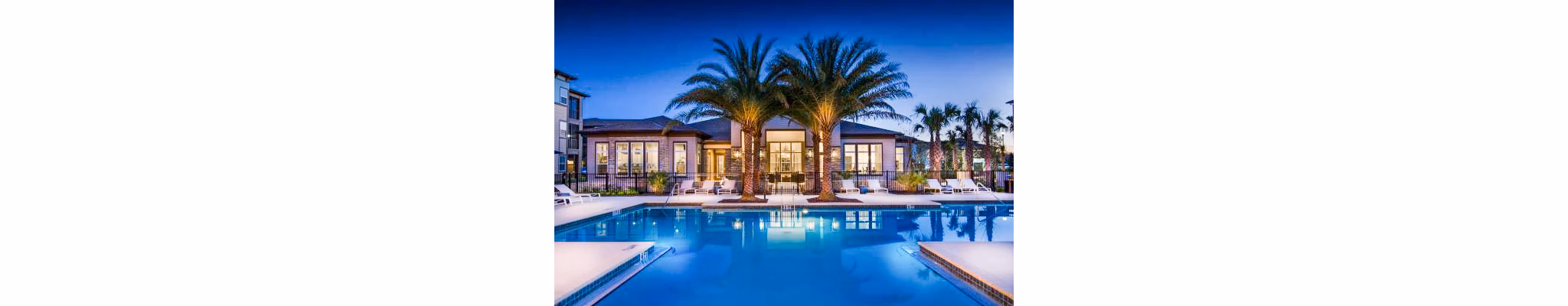 Rooftop pool with surrounding deck at Tapestry at Lake Park Apartments, offering relaxing leisure spaces