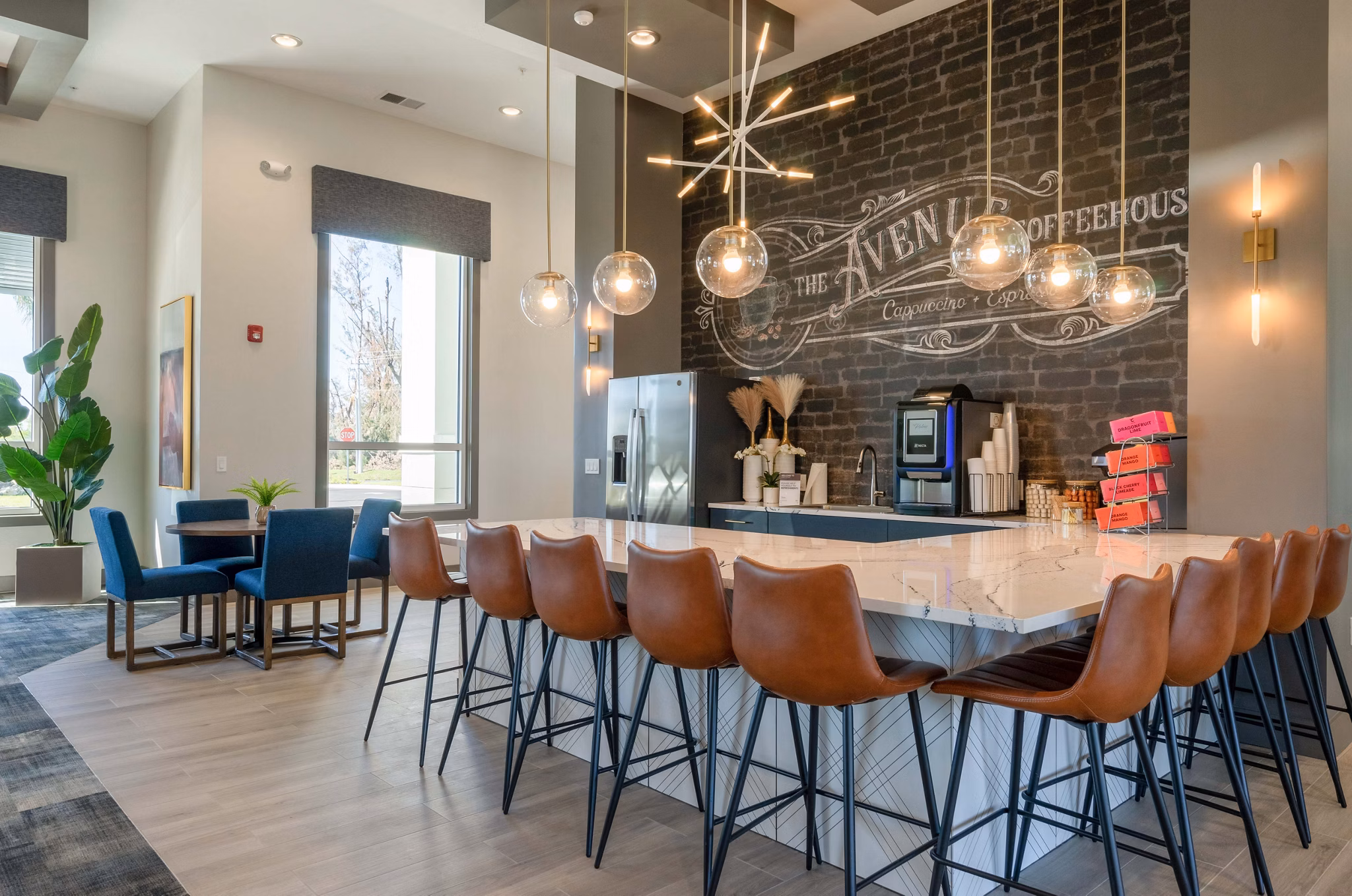 Clubhouse with modern lounge seating at The Palms at Cape Coral Apartments