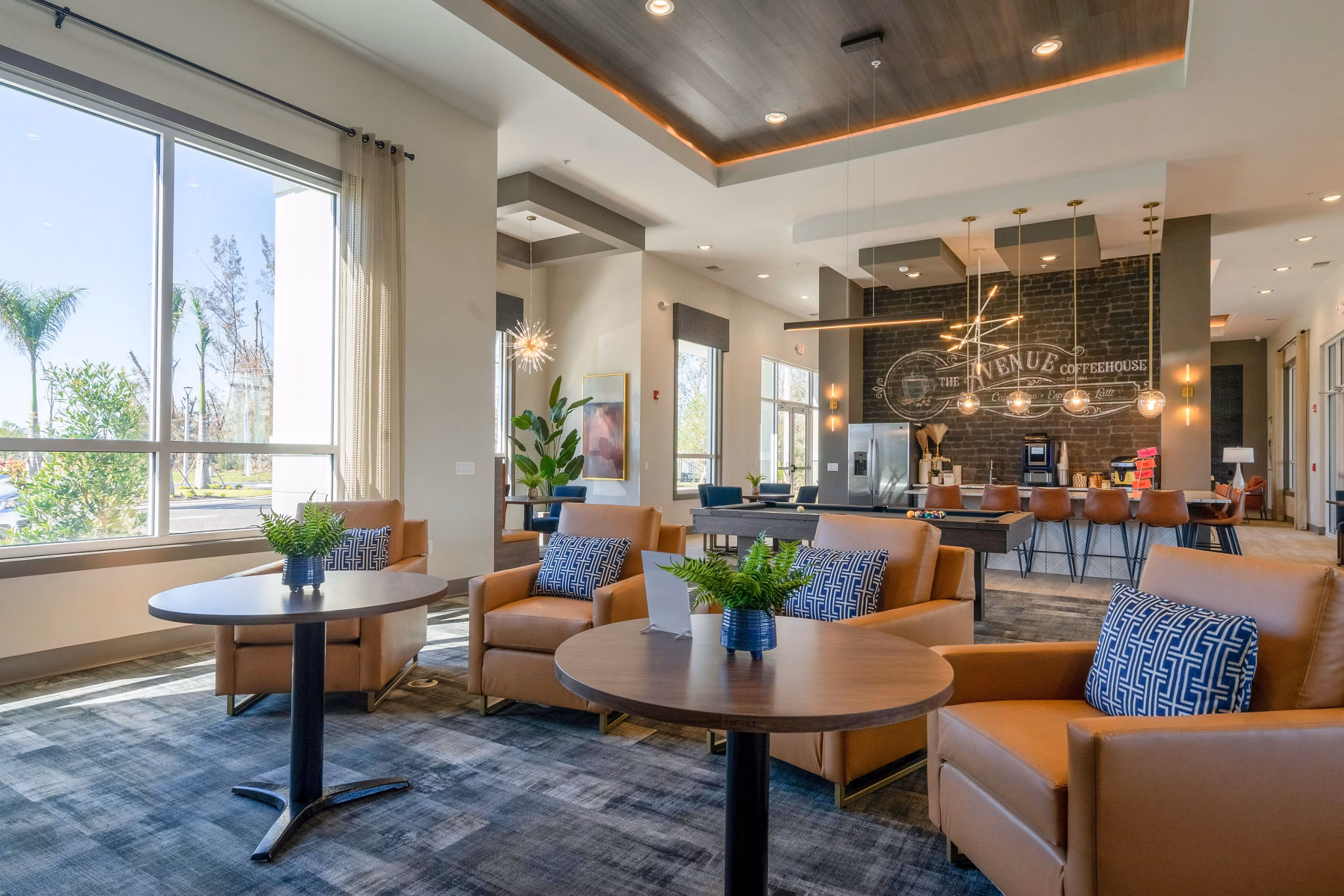 Clubhouse with modern design elements at The Palms at Cape Coral Apartments, offering luxury communal spaces for residents