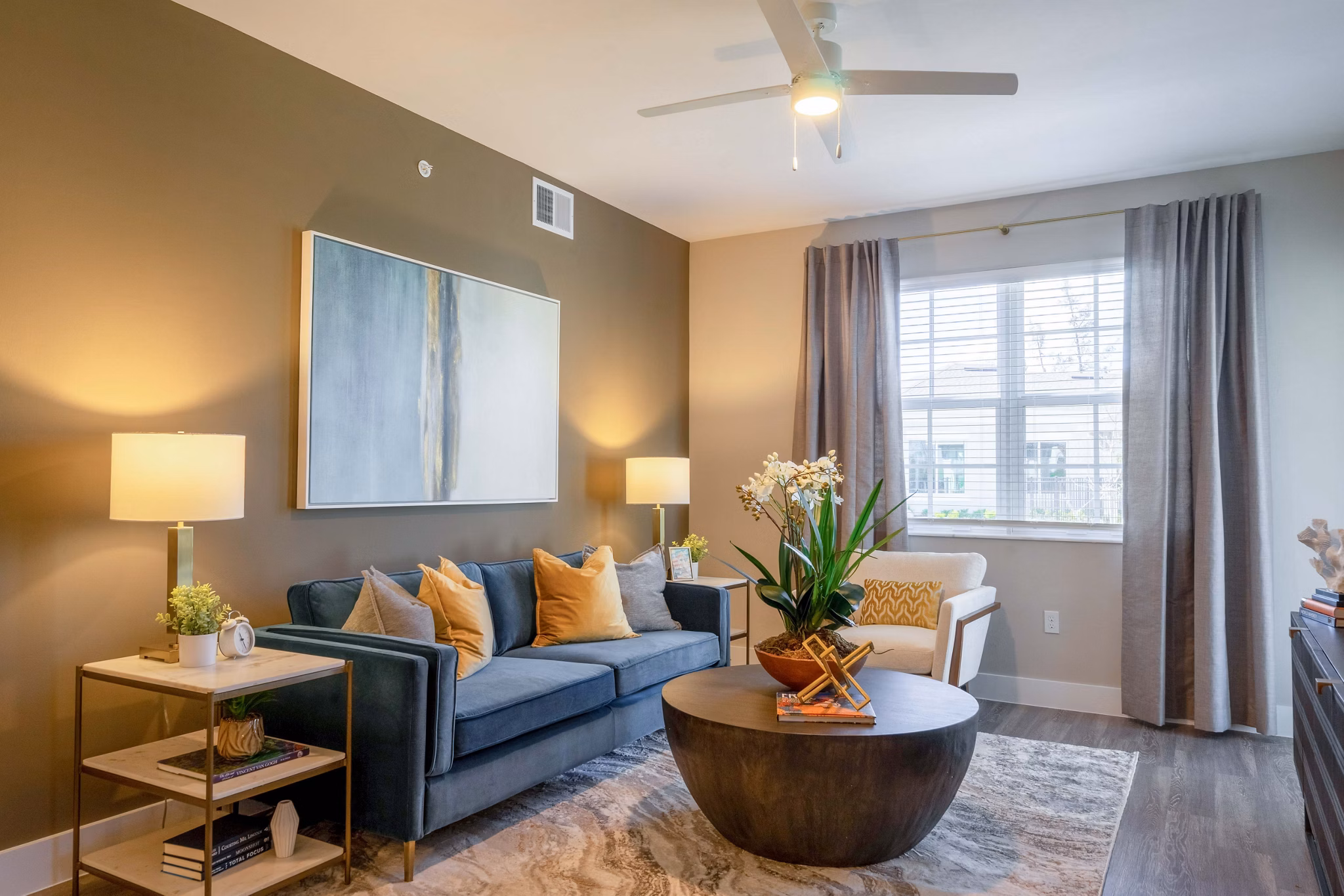 Spacious living room with modern decor at The Palms at Cape Coral Apartments