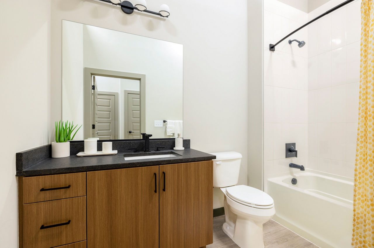 Bathroom featuring sleek fixtures and modern design at Marlow Apartments