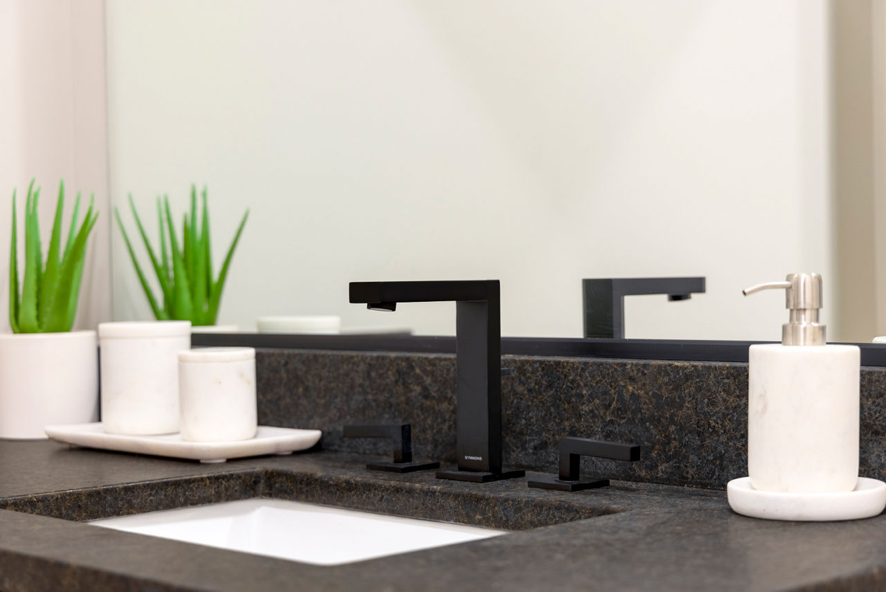 Bathroom featuring sleek fixtures and modern design at Marlow Apartments