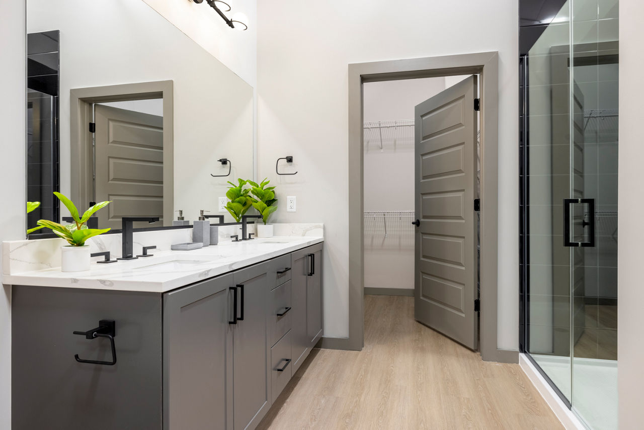 Bathroom with sleek fixtures and granite countertops at Marlow Apartments luxury rentals