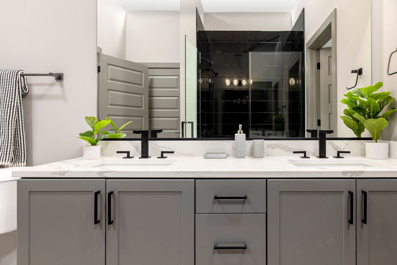 Bathroom featuring modern fixtures and marble countertops at Marlow Apartments