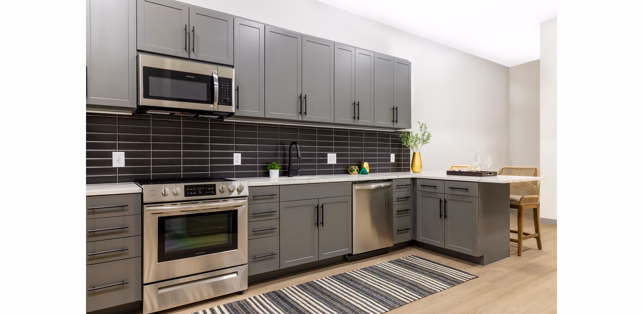 Modern kitchen with stainless steel appliances and sleek countertops at Marlow Apartments luxury residence