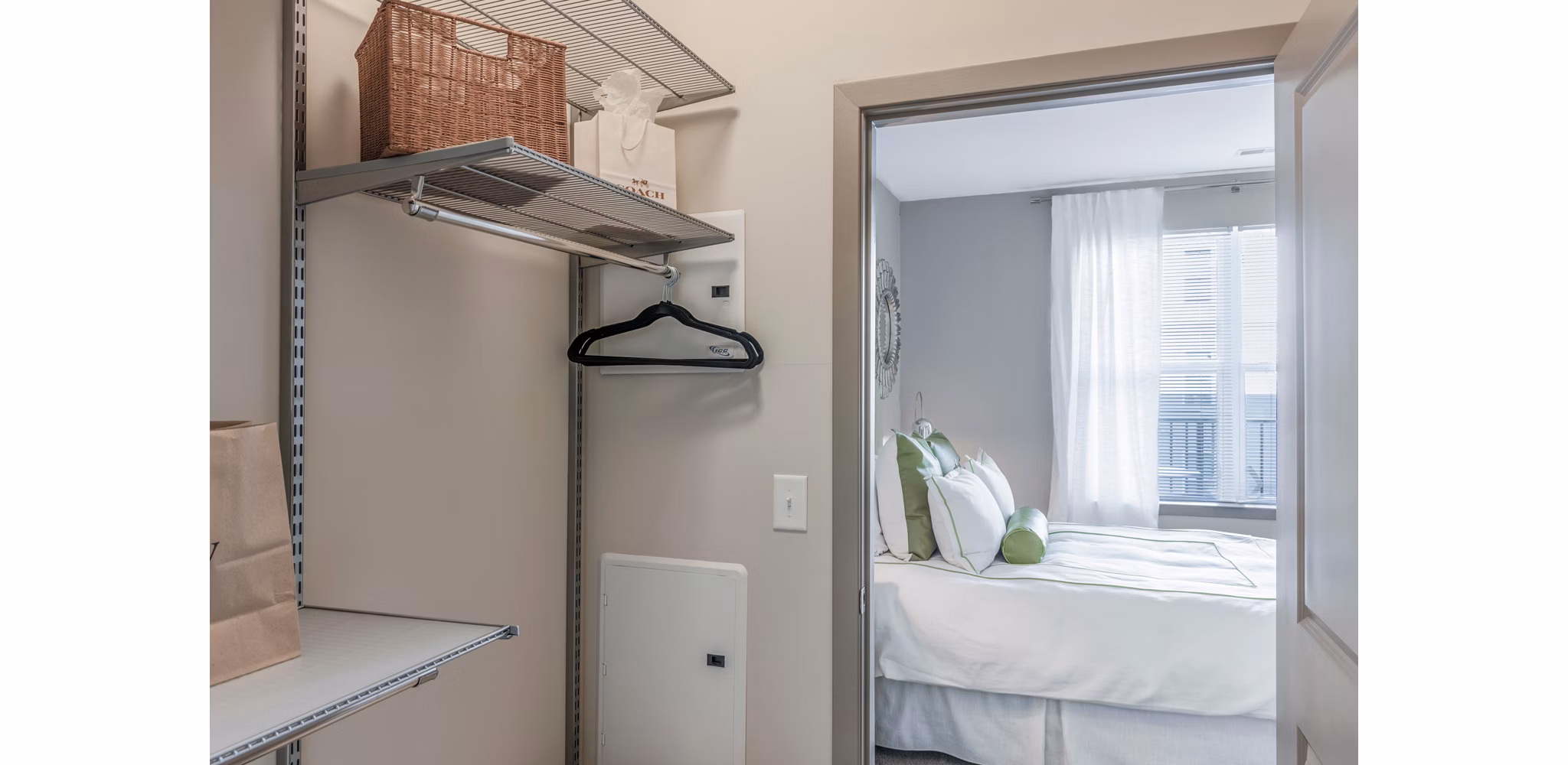 Cozy bedroom with modern decor at Esplanade at National Harbor Apartments featuring luxury living spaces
