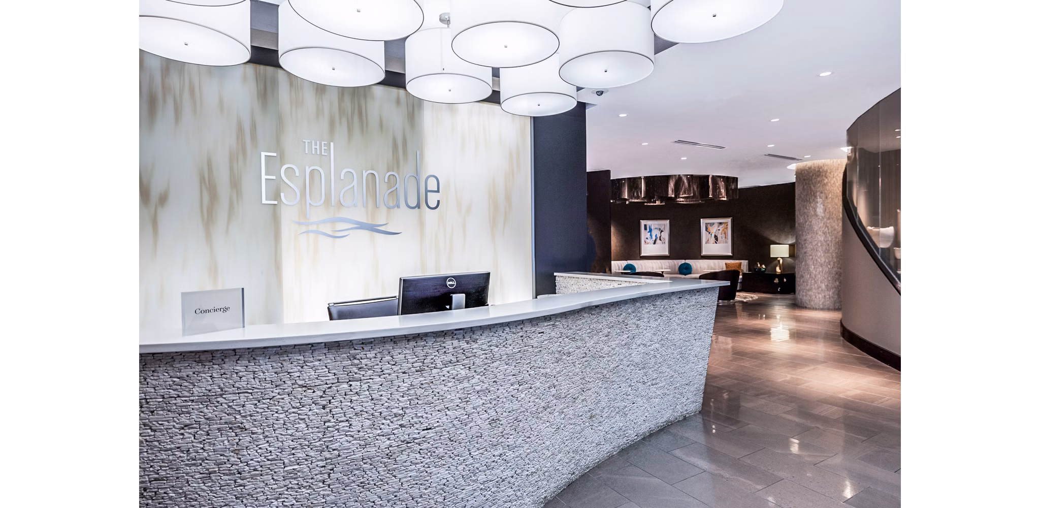 Clubhouse lobby with modern furnishings at Esplanade at National Harbor Apartments, offering luxury living and community spaces