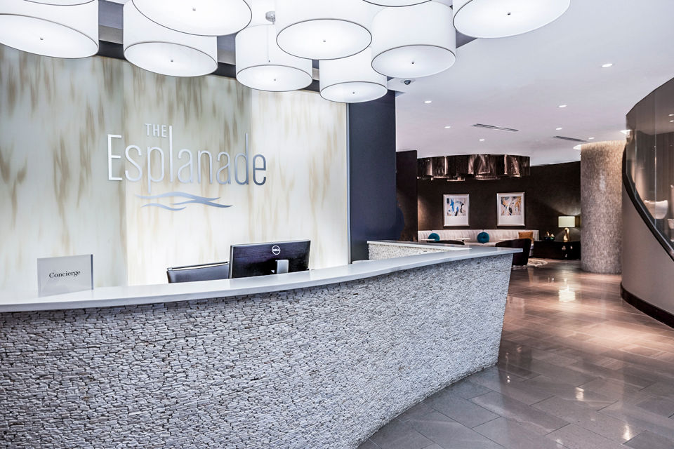 Clubhouse lobby with modern furnishings at Esplanade at National Harbor Apartments, offering luxury living and community spaces