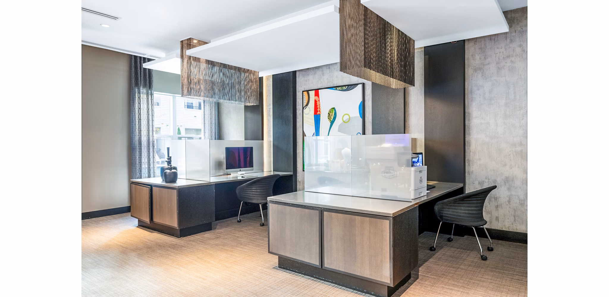 Elegant clubhouse lobby with plush seating at Esplanade at National Harbor Apartments, offering residents a luxurious communal space to relax and socialize
