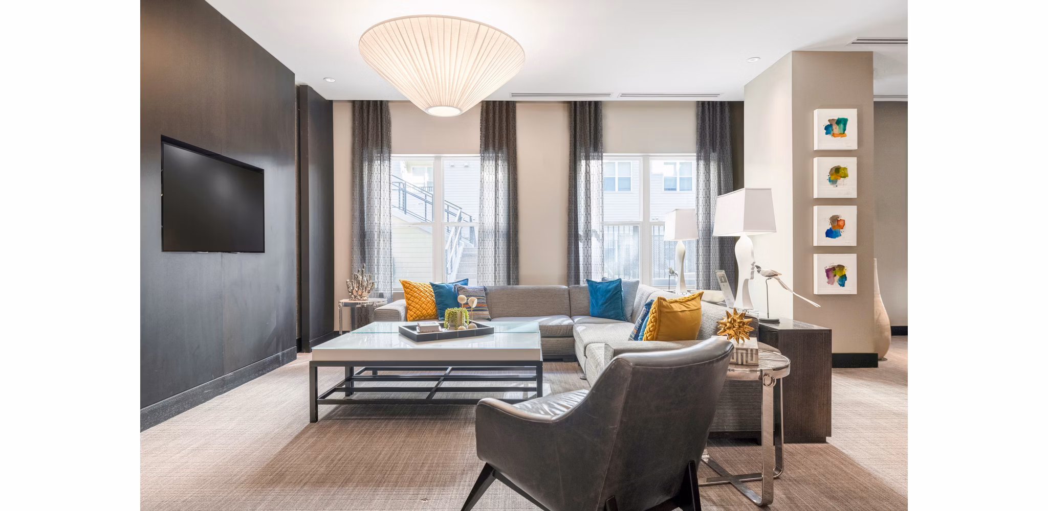 Contemporary clubhouse lobby with elegant furnishings at Esplanade at National Harbor Apartments, offering a welcoming community space for residents