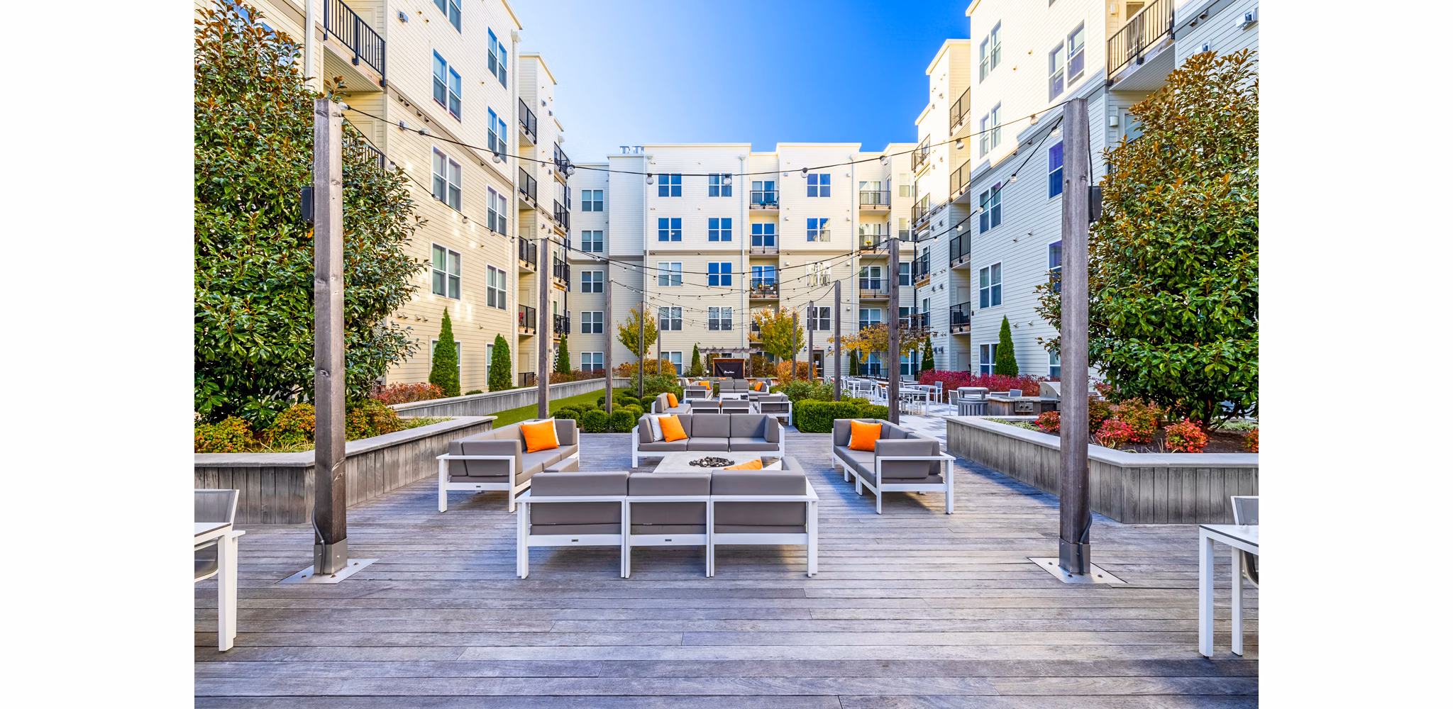 Patio with comfortable seating at Esplanade at National Harbor Apartments, ideal for relaxing and entertaining outdoors