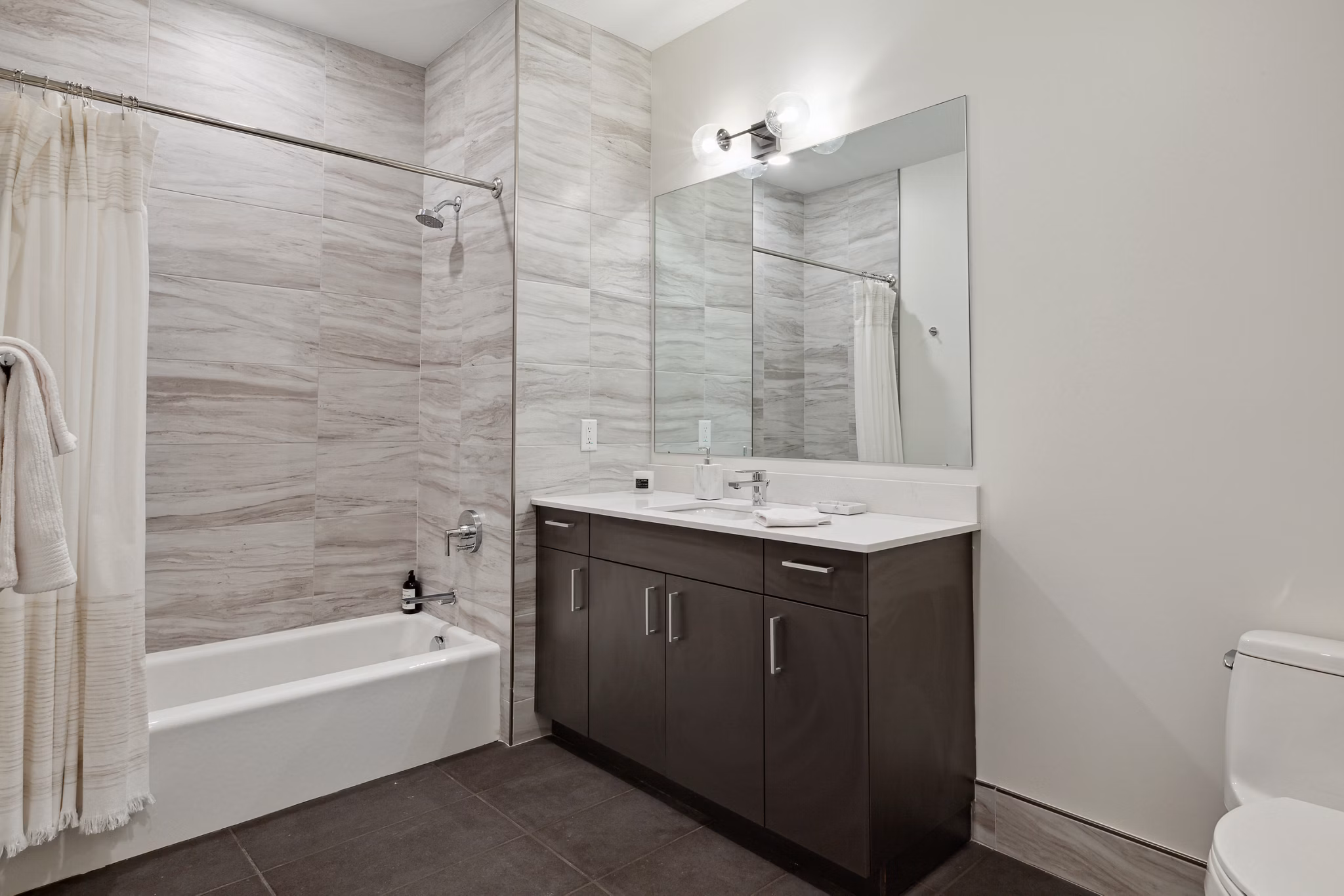 Bathroom featuring modern fixtures at Motif Apartments, a luxury community by Greystar