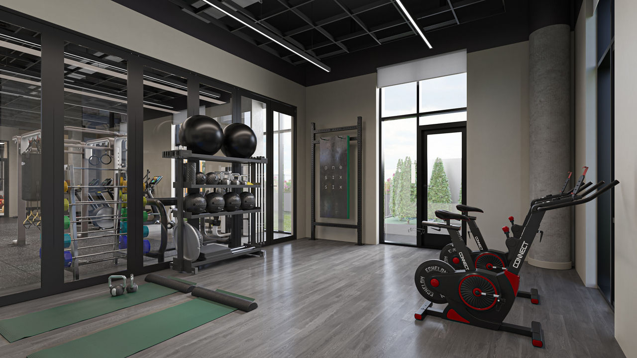 State-of-the-art fitness center with modern equipment at One Six Six Apartments