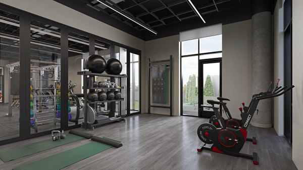 State-of-the-art fitness center with modern equipment at One Six Six Apartments