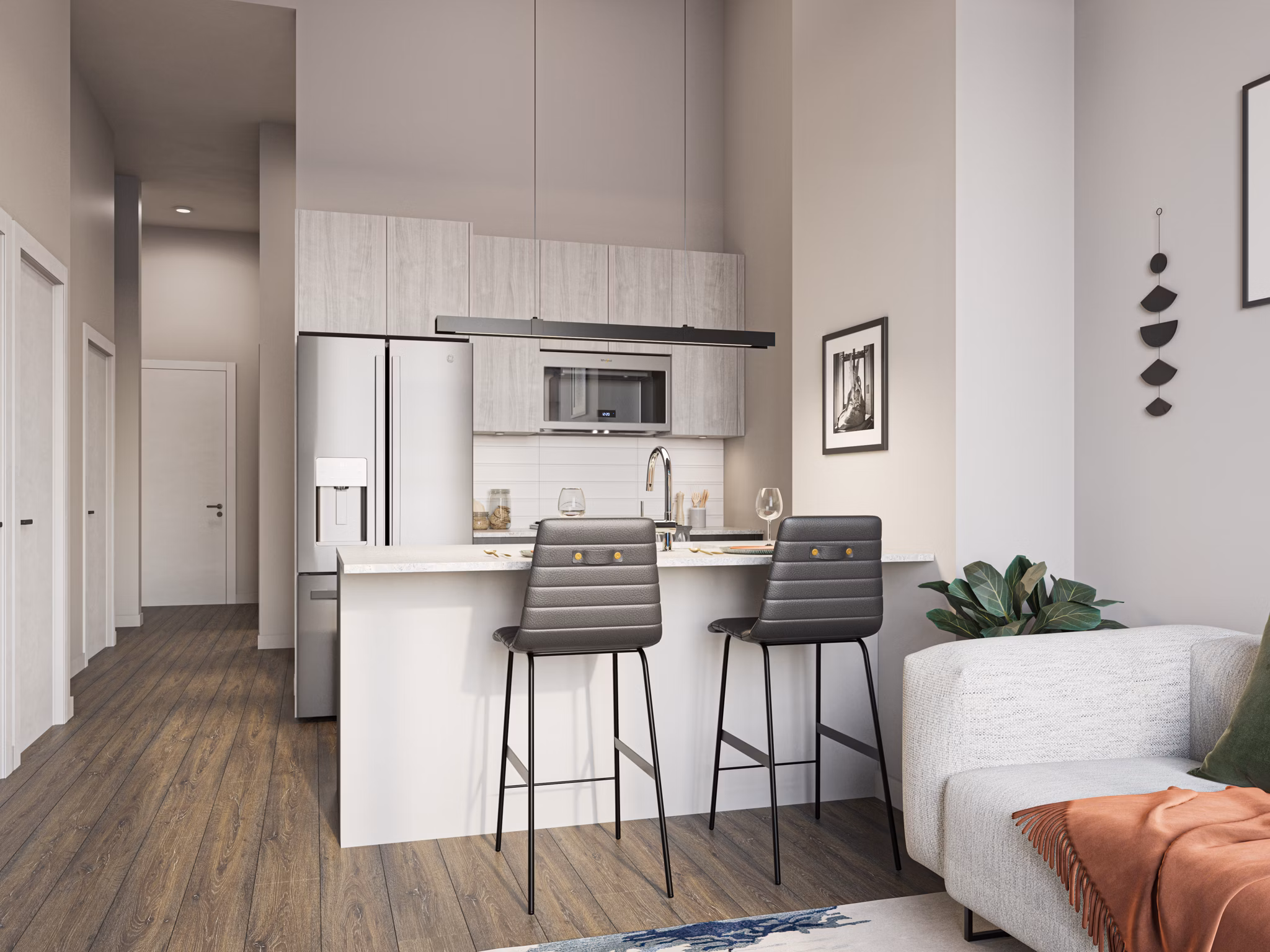 Modern kitchen with stainless steel appliances at One Six Six Apartments