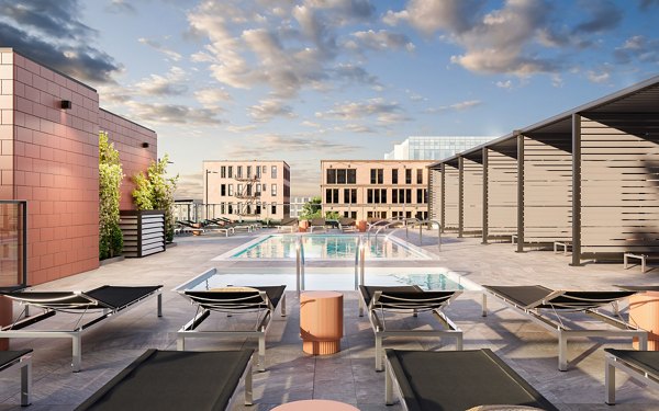 Outdoor pool area with lounge seating at One Six Six Apartments, offering luxurious amenities for residents to relax and enjoy