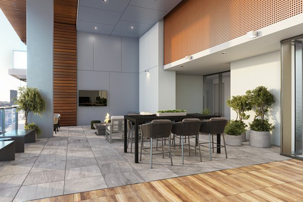 Cozy outdoor patio with stylish seating at One Six Six Apartments