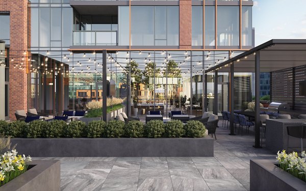 Courtyard at One Six Six Apartments featuring modern seating and lush landscaping for a luxurious outdoor retreat