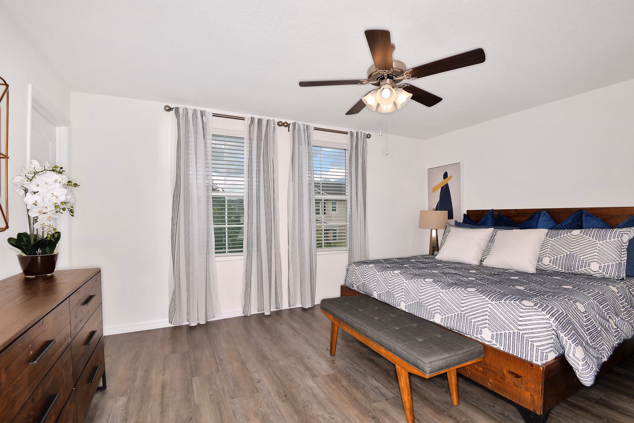 Cozy bedroom with natural light at Summerwell Avian Pointe Apartments