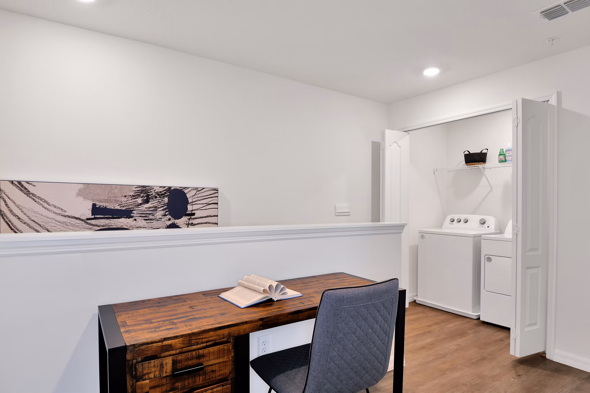 Elegant hallway with modern lighting and hardwood floors in Summerwell Avian Pointe Apartments