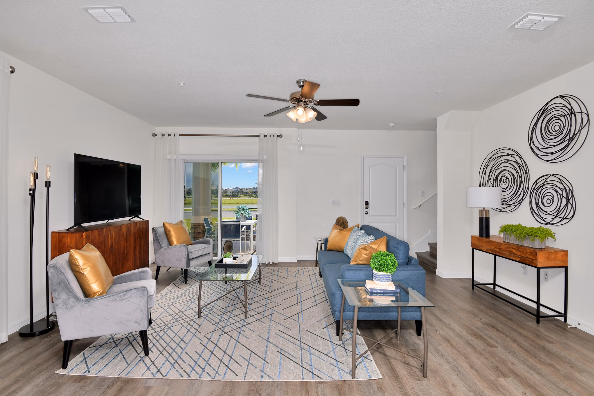 Spacious living room with modern dÃ©cor at Summerwell Avian Pointe Apartments