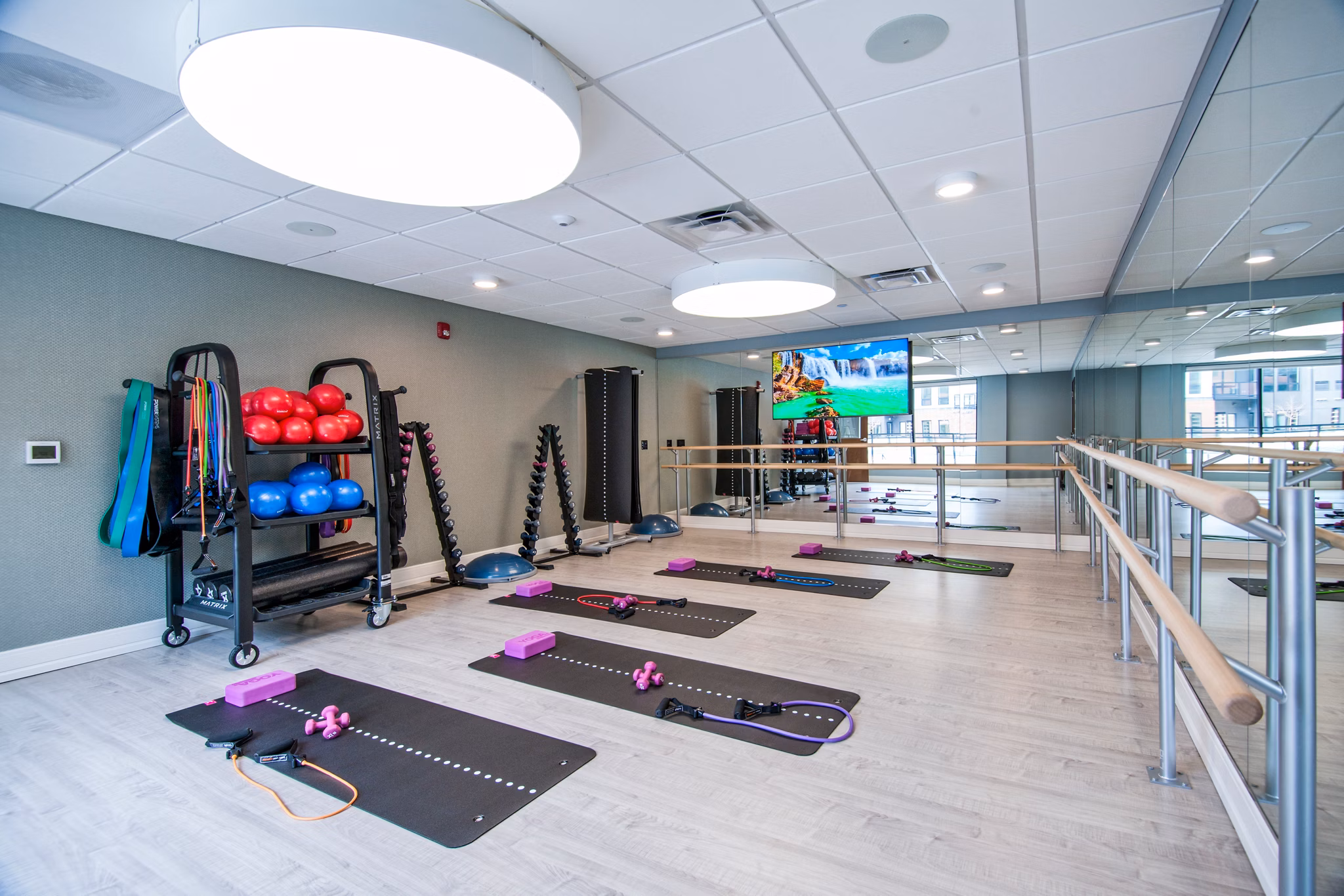 Modern fitness center with state-of-the-art equipment at Avidor Glenview Apartments