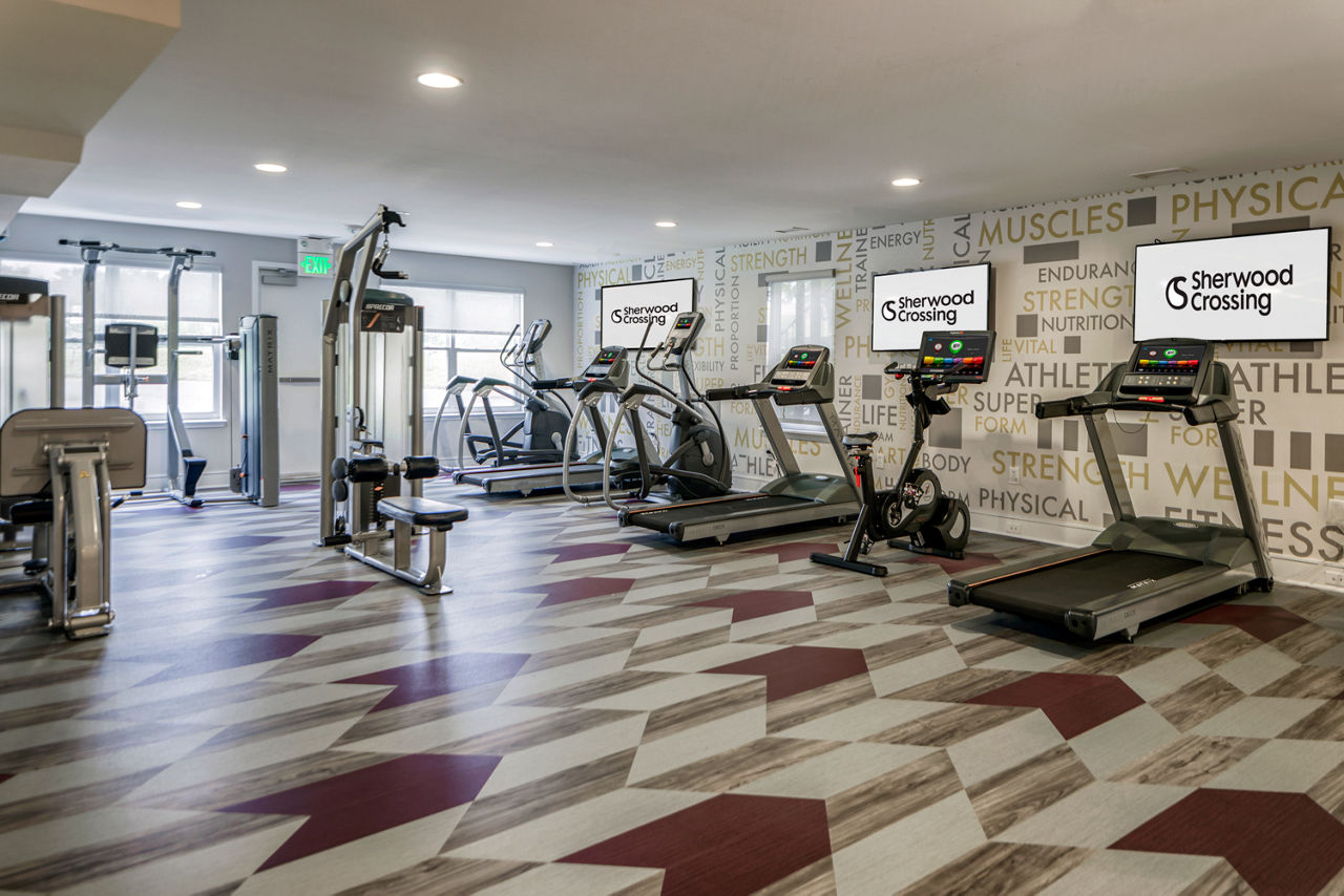 Fitness center with modern equipment at Sherwood Crossing apartments