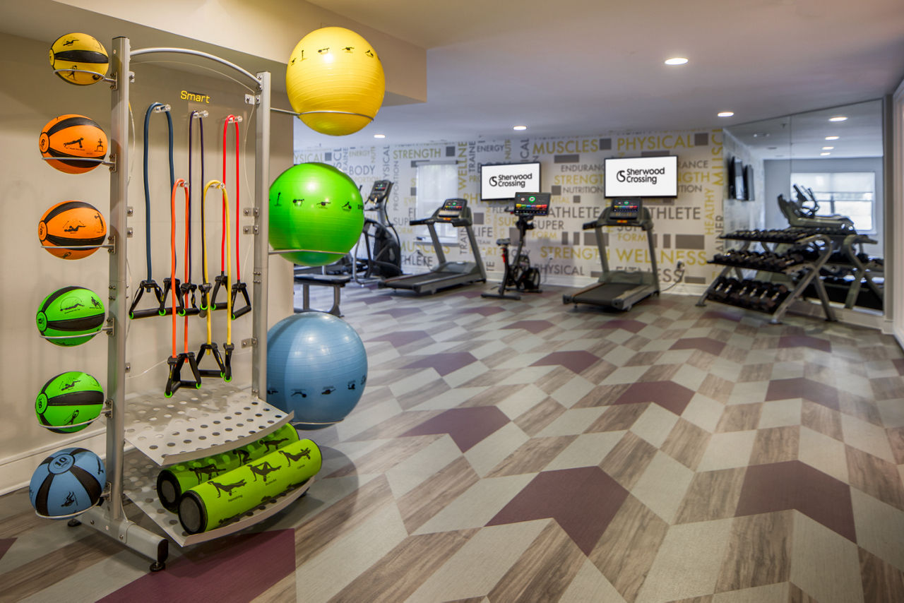 State-of-the-art fitness center with modern equipment at Sherwood Crossing luxury apartments