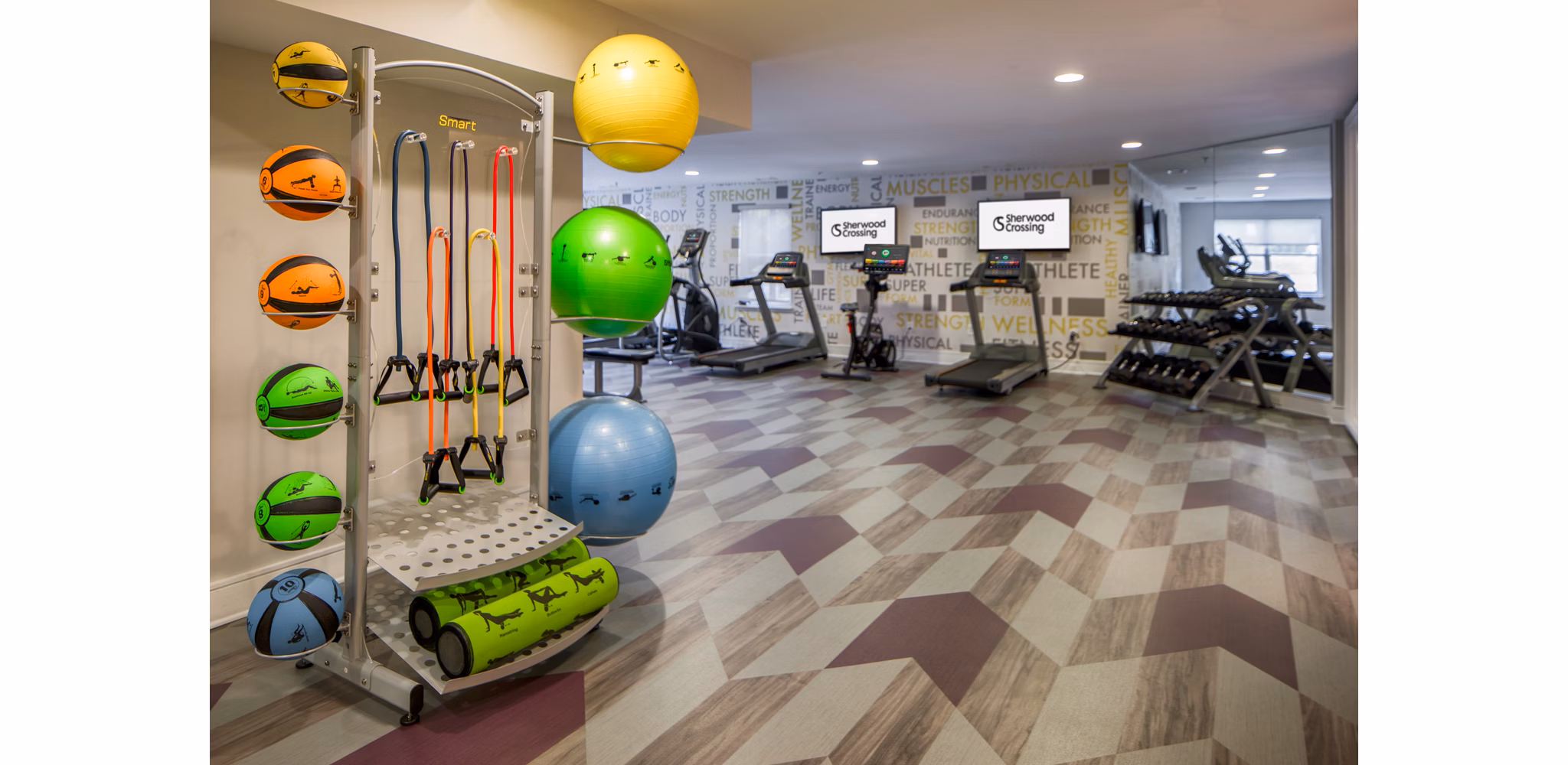 State-of-the-art fitness center with modern equipment at Sherwood Crossing luxury apartments