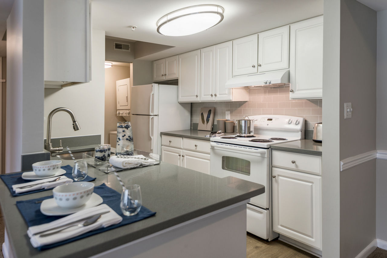 Modern kitchen with stainless steel appliances at Sherwood Crossing luxury apartments