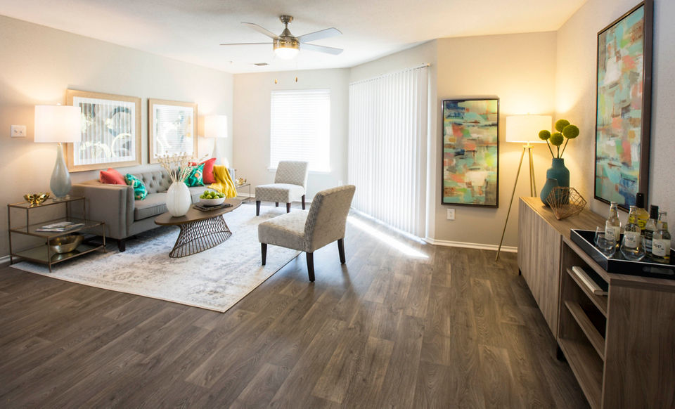 Living room featuring plush seating and modern decor in Sherwood Crossing apartments