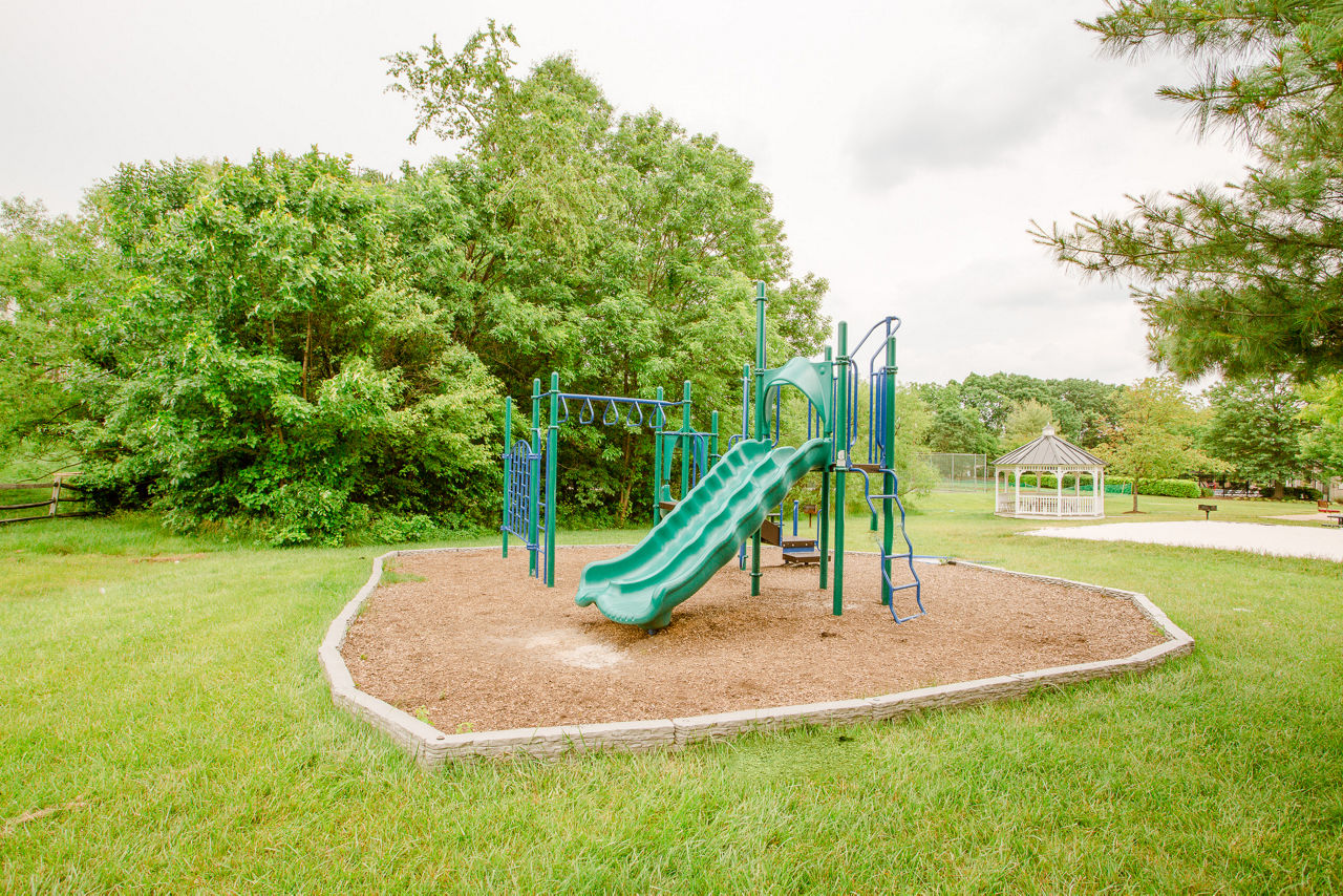 Modern playground with colorful equipment at Sherwood Crossing luxury apartments