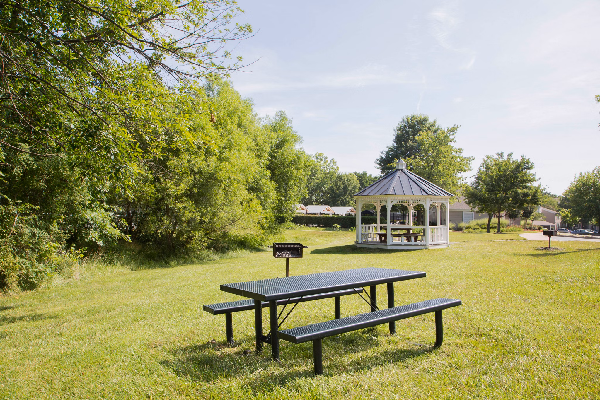 Grill and picnic area at Sherwood Crossing with outdoor seating for gatherings